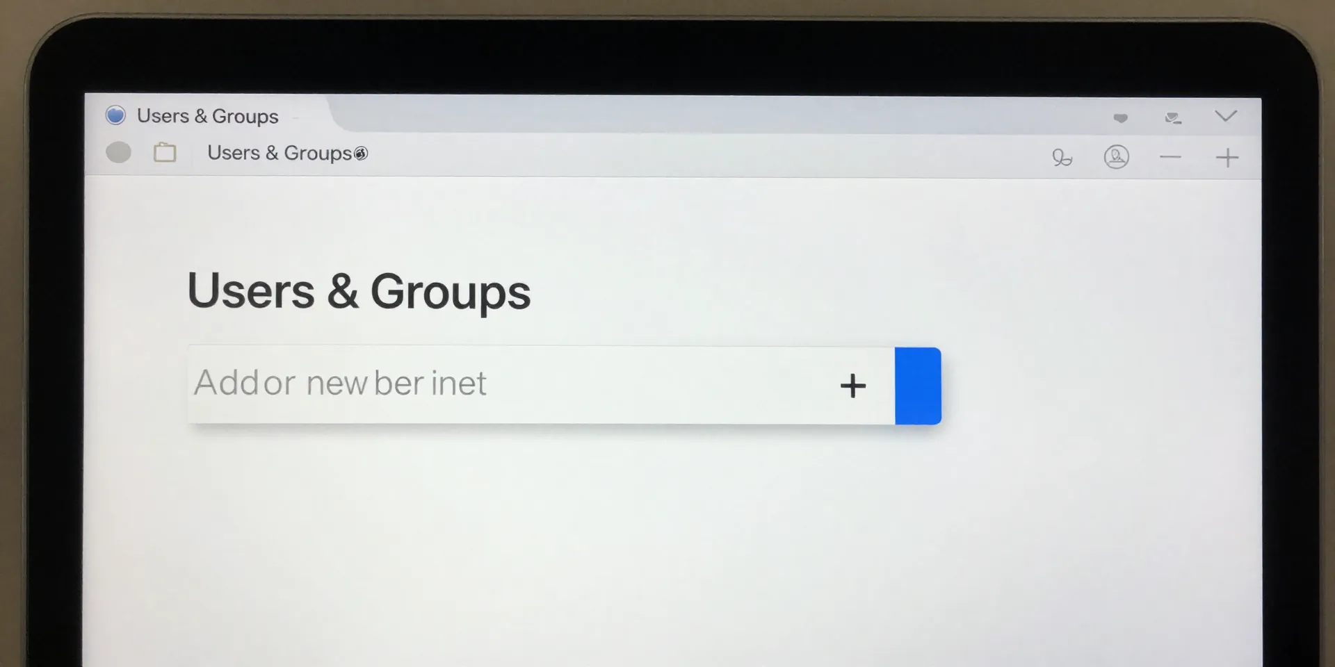 MacOS System Preferences screen showing ‘Users & Groups’, button to add a new user. sharp interface, on a MacBook screen